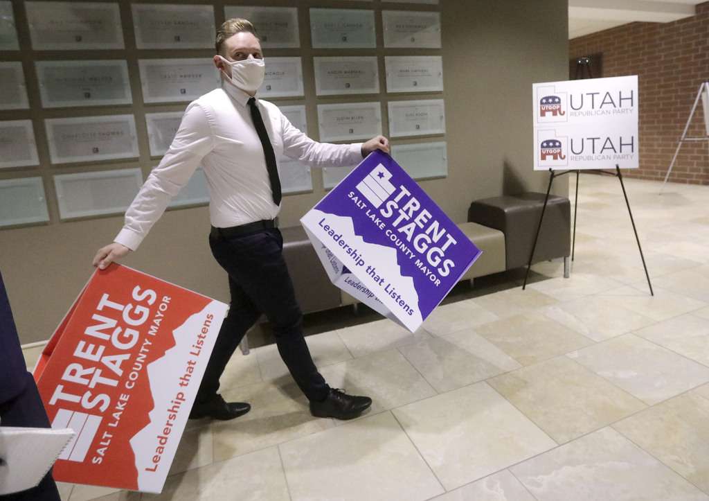 Chris Harelson, campaign manager for Salt Lake County mayoral candidate Trent Staggs, brings signs to an election night event for Republican candidates at the Utah Association of Realtors building in Sandy on Tuesday, Nov. 3, 2020.