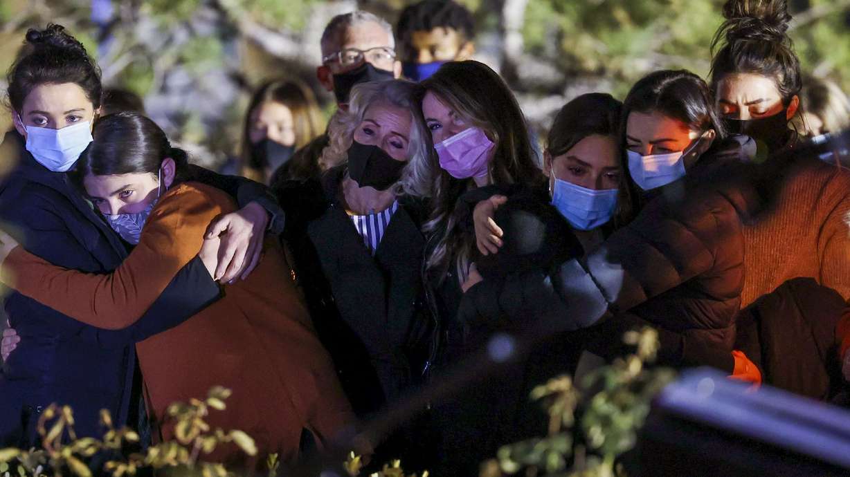 Parents, faculty and students gather at the Skaggs Catholic Center Grotto of Our Lady of Guadalupe at Juan Diego Catholic High School in Draper to recite the rosary on Wednesday, Nov. 4, 2020. The group gathered after a shooting in Nevada killed Diana Hawatmeh and her son Joseph, a seventh grader at St. John the Baptist Middle School in Draper, and left another daughter, Yasmeen, in critical condition at a Las Vegas hospital. The Hawatmehs, a highly involved family at the Skaggs Catholic Center, are members of St. John the Baptist Parish. Diana Hawatmeh was a substitute teacher in the elementary and middle school and taught Zumba dance to members of the faculty.