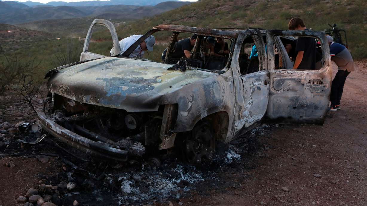 A man has been arrested in connection with last year's massacre of nine Mormon American-Mexican citizens on a remote dirt road in northwestern Mexico, officials in that country said. In this photo, relatives of the slain examine one of the three vehicles that were attacked in Mexico's Sonora state.