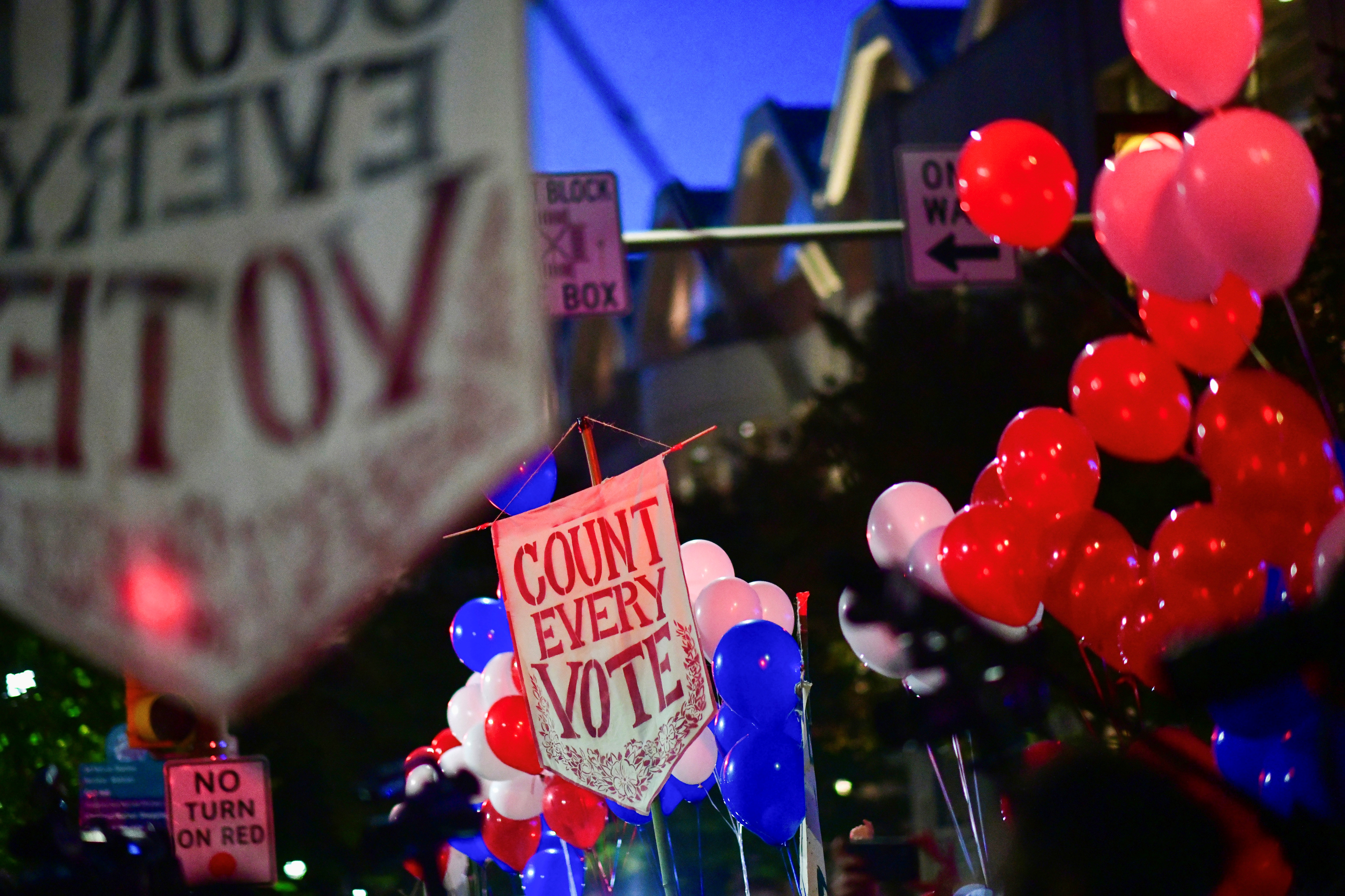 Signs and balloons are displayed in a "Count Every Vote" dance party outside of the Philadelphia Convention Center, where votes are still being counted two days after the 2020 U.S. presidential election, in Philadelphia, Pennsylvania, U.S. November 5, 2020.