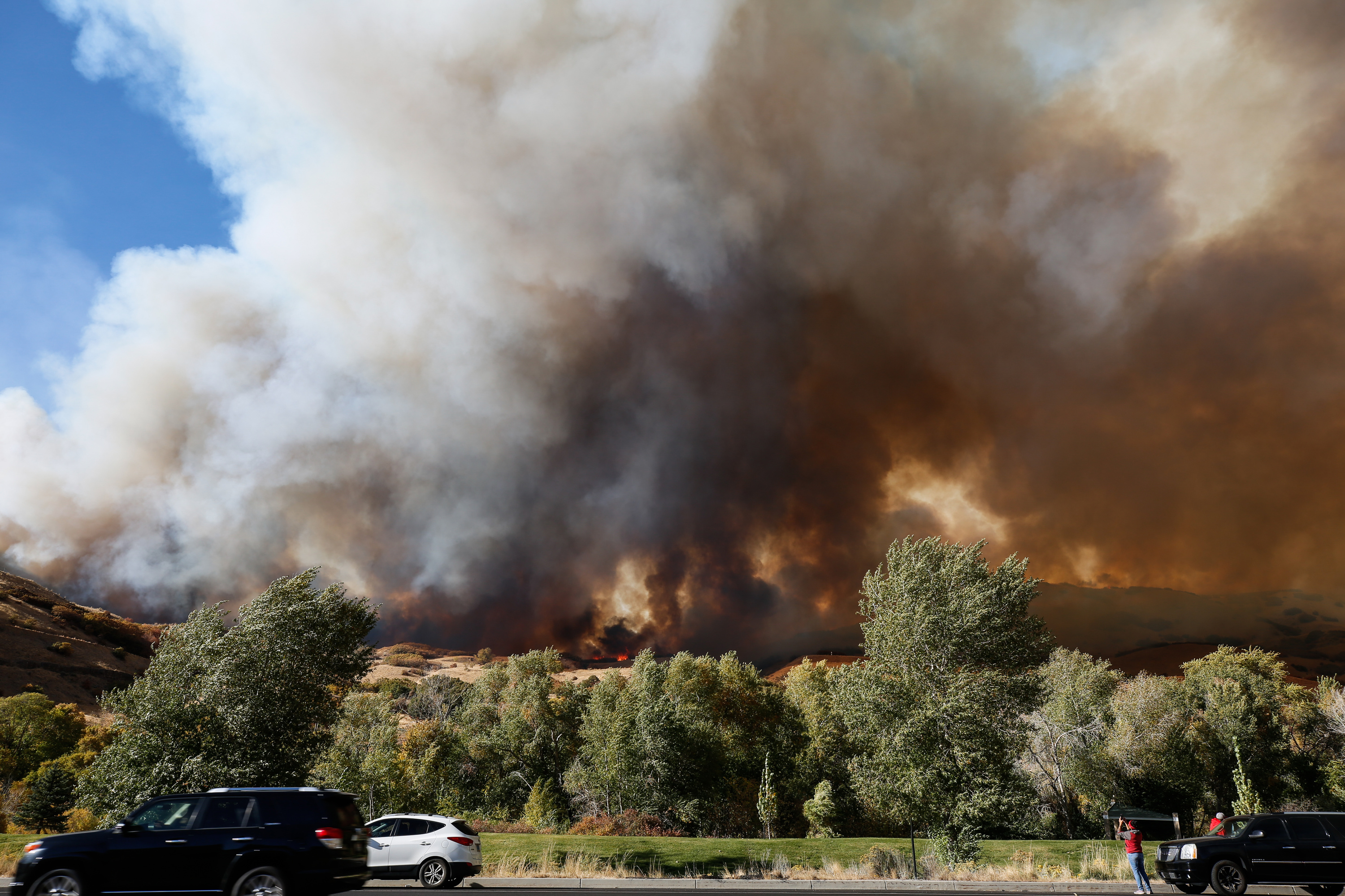 Smoke from aÂ brush fire that broke out at the base of Mount Timpanogos in Orem is pictured on Saturday, Oct. 17, 2020.