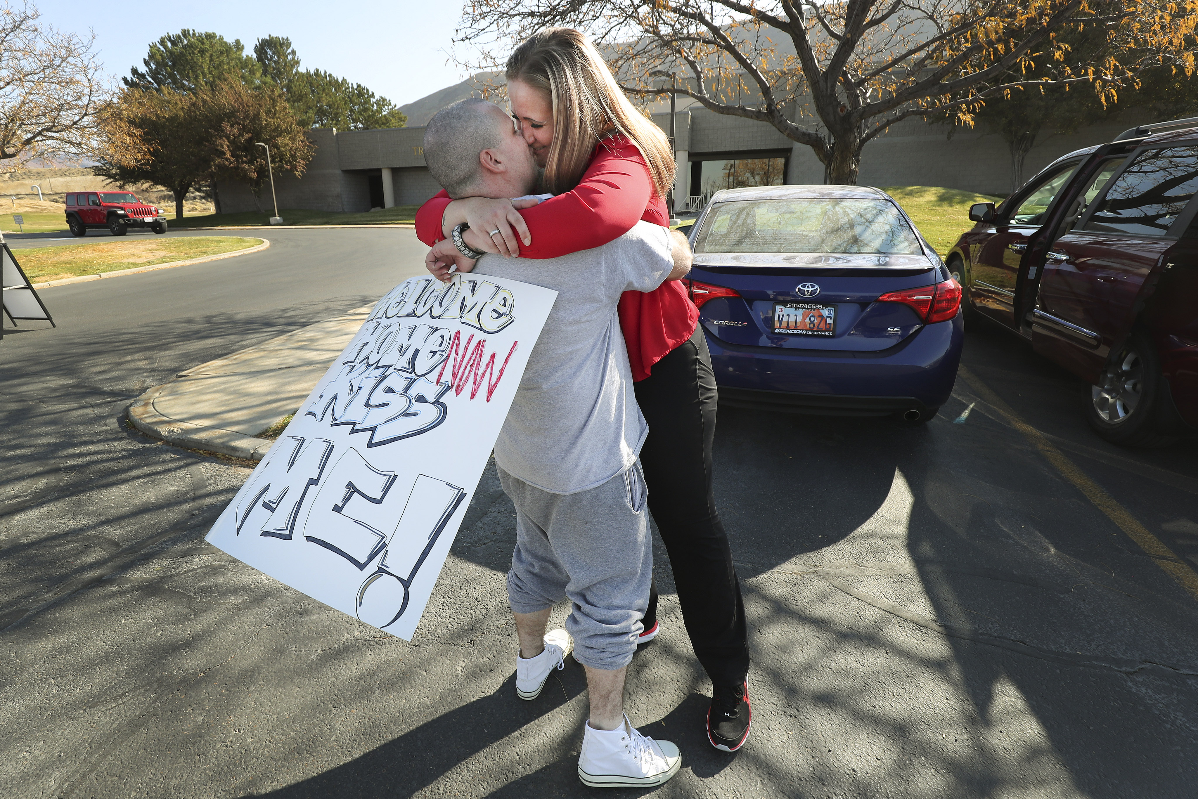Carrie Knowlton hugs husband Michael Knowlton after he was released from the Utah State Prison in Draper on Tuesday Nov. 3, 2020. Some inmates are being granted early release because of coronavirus outbreaks.
