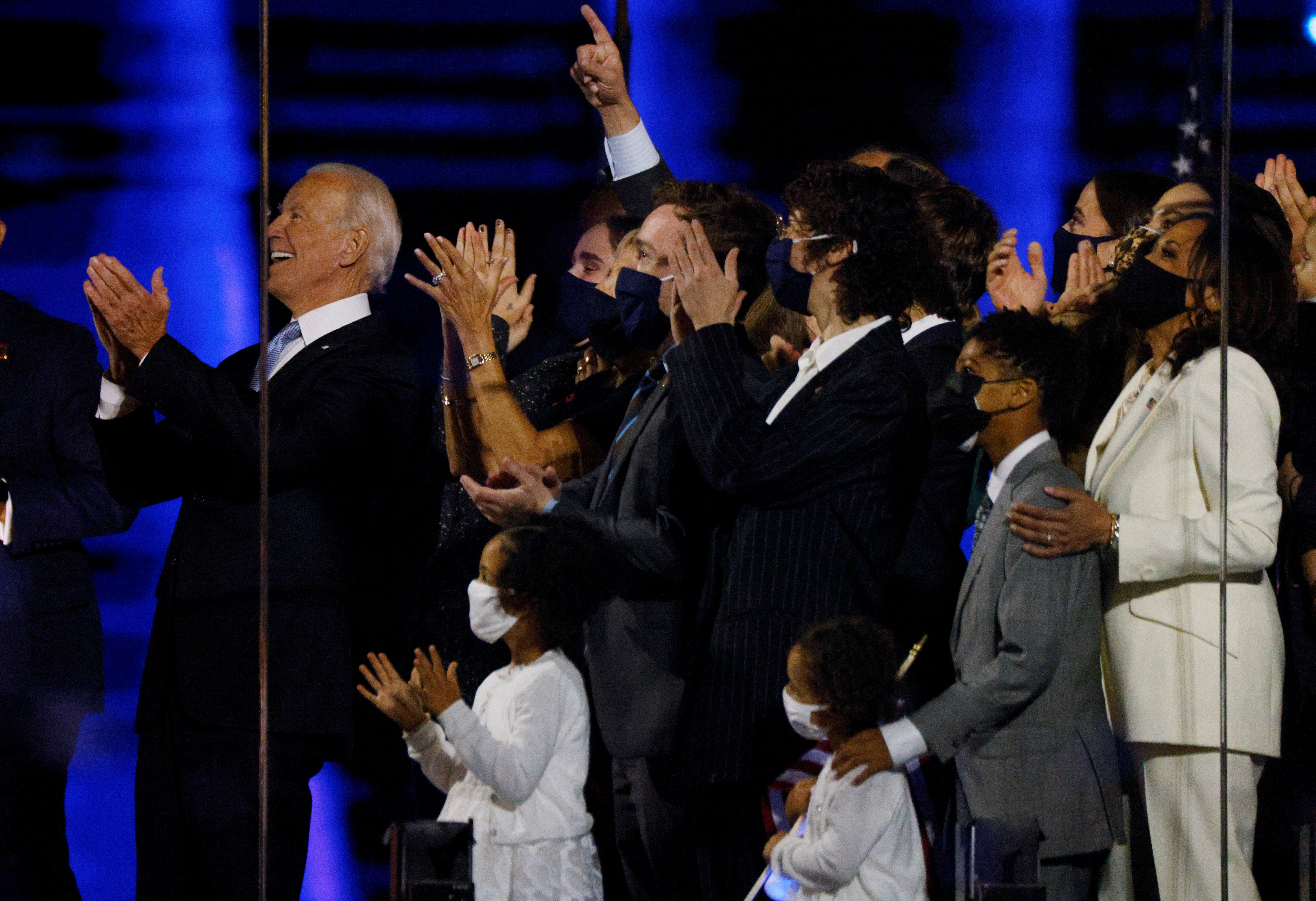 Democratic 2020 U.S. presidential nominee Joe Biden, vice presidential nominee Kamala Harris and their families celebrate onstage at his election rally, after the news media announced that Biden has won the 2020 U.S. presidential election over President Donald Trump, in Wilmington, Delaware, U.S., November 7, 2020. REUTERS/Jim Bourg