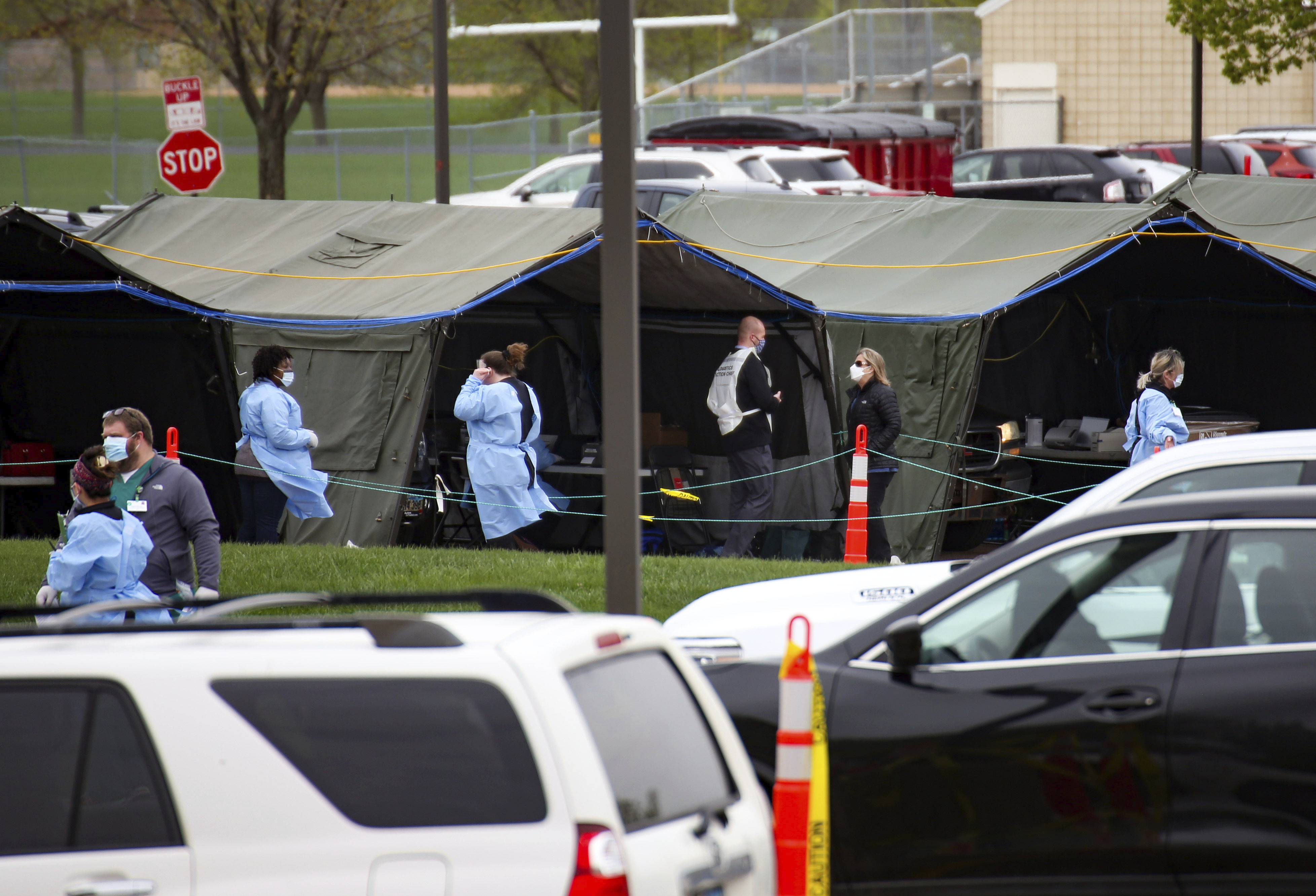 FILE - In this May 4, 2020, file photo, healthcare workers run a coronavirus testing site for Smithfield employees in the Washington High School parking lot on Monday, May 4, 2020, in Sioux Falls, S.D. North Dakota and South Dakota have the nation's worst rate of coronavirus deaths per capita in the last 30 days. Despite advances in treating coronavirus patients, hundreds more people in the Dakotas have died in recent weeks than during any other time of the pandemic. (Erin Bormett/The Argus Leader via AP, File) [Nov-09-2020]