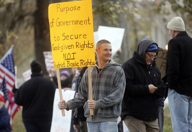 Andrew Pulsipher protests Gov. Gary Herbert’s mask mandate and new COVID-19 restrictions outside of the Governor’s Mansion in Salt Lake City on Monday, Nov. 9, 2020.