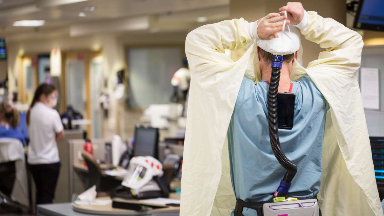 Health care workers treat COVID-19 patients at the University of Utah Hospital Wednesday, Aug. 19, 2020.