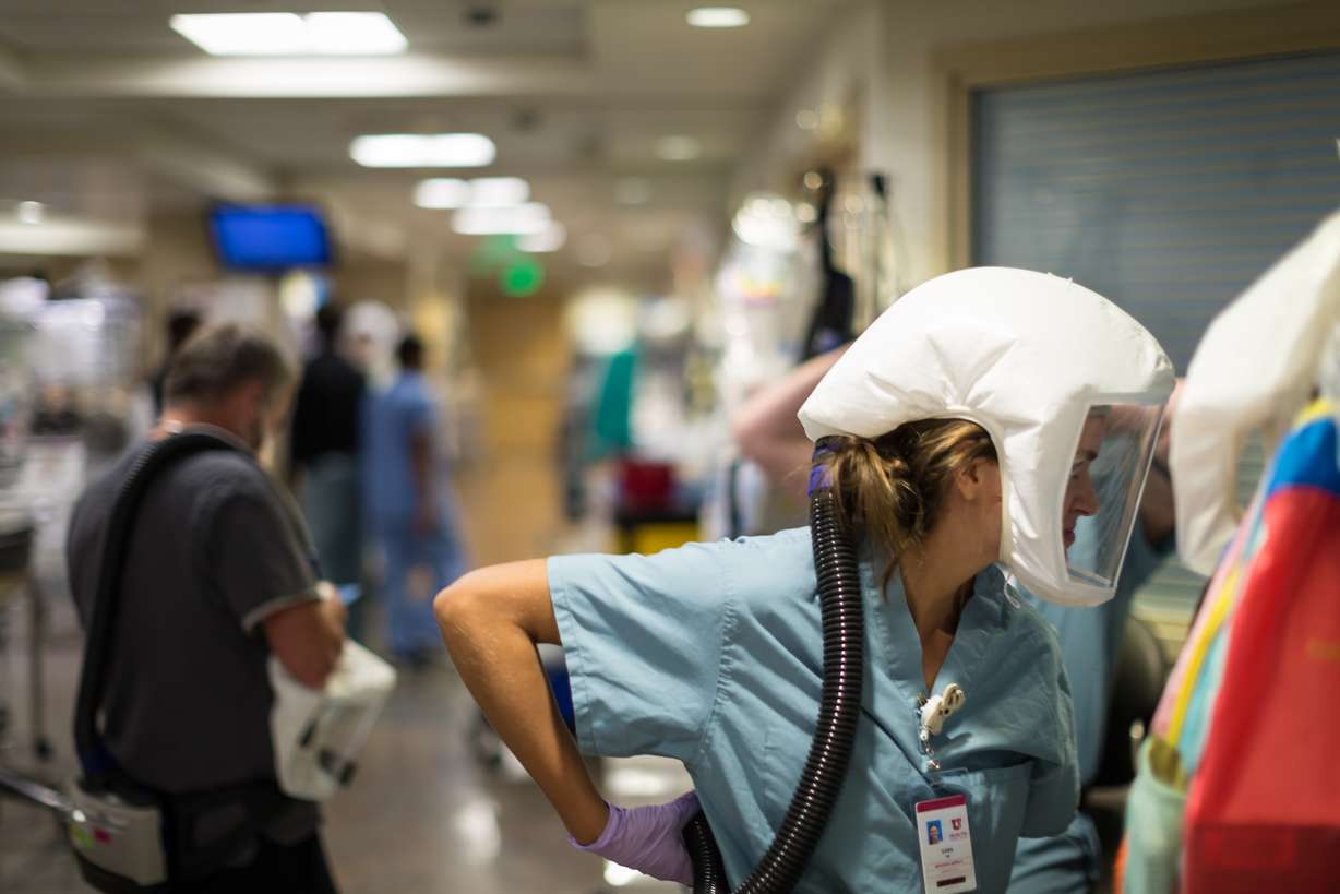 Health care workers treat COVID-19 patients at the University of Utah Hospital Wednesday, Aug. 19, 2020.
