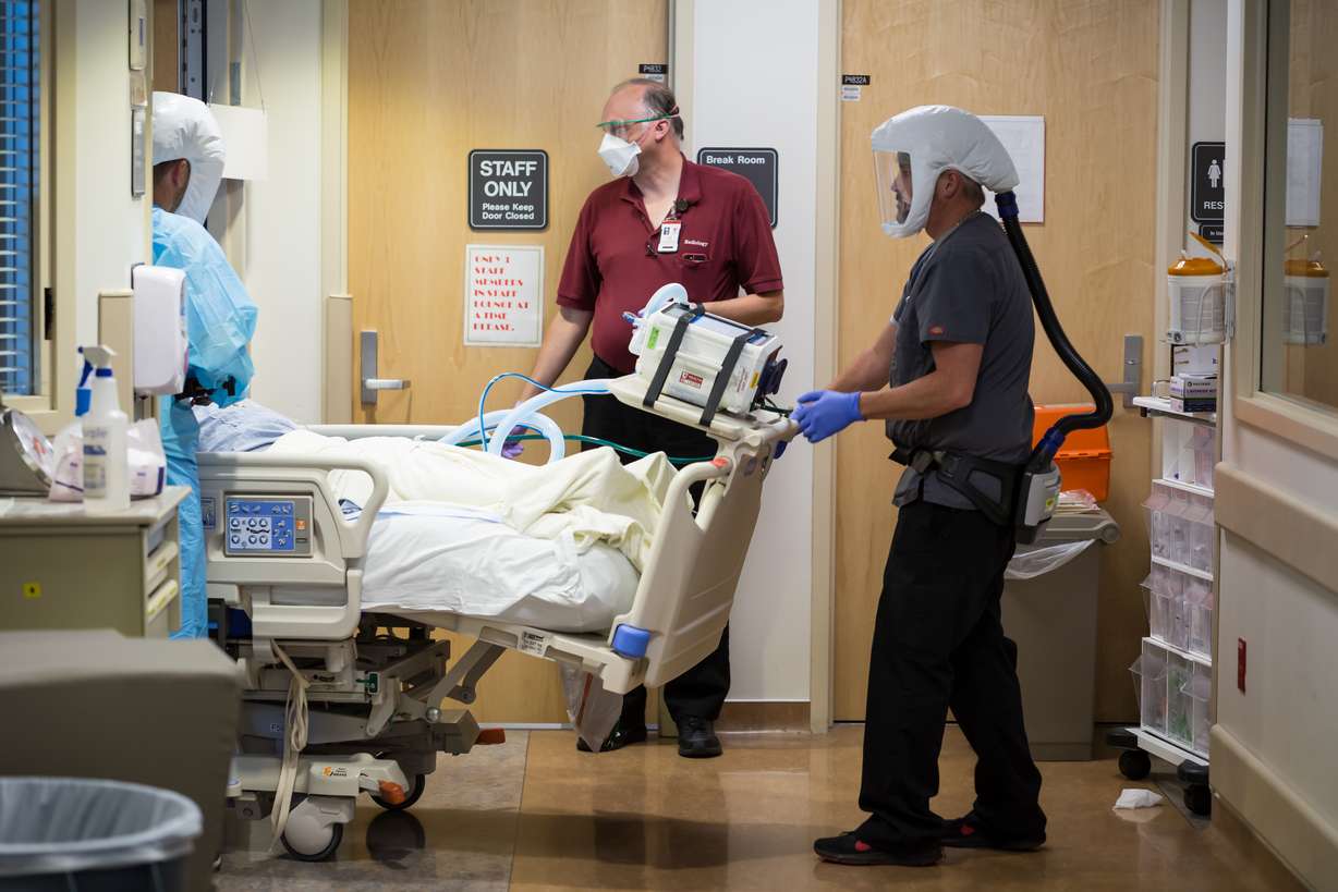 Health care workers treat COVID-19 patients at the University of Utah Hospital Wednesday, Aug. 19, 2020.