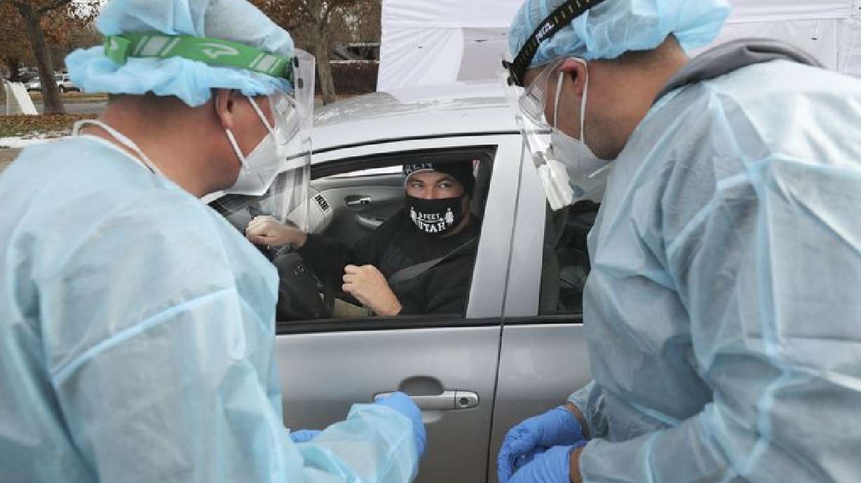 Jon O’Brien gets a COVID-19 test at a Utah National Guard Joint Task Force 97 mobile testing site in Salt Lake City on Tuesday, Nov. 10, 2020. The Guard has approximately 275 service members mapping support for contact tracing, mobile testing, facility assessment and training, and warehouse operations.