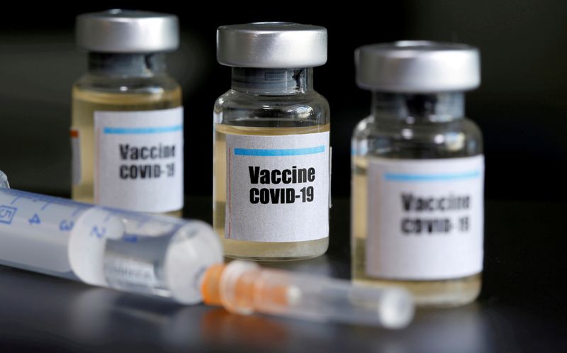 FILE PHOTO: Small bottles labeled with a "Vaccine COVID-19" sticker and a medical syringe are seen in this illustration taken taken April 10, 2020. REUTERS/Dado Ruvic