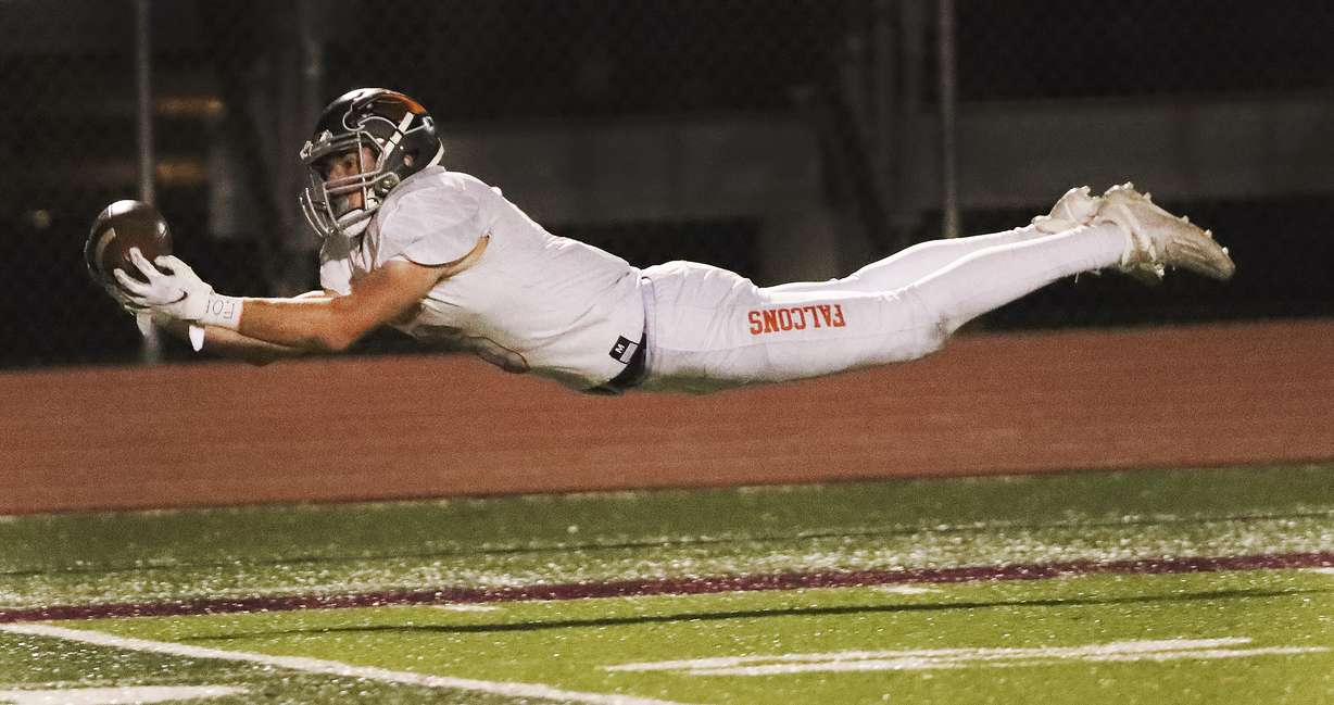 Skyridge's James Palmer (6) stretches out for a catch that later led to a touchdown against Lone Peak in a 6A semifinal football game in Eagle Mountain on Thursday, Nov. 12, 2020.