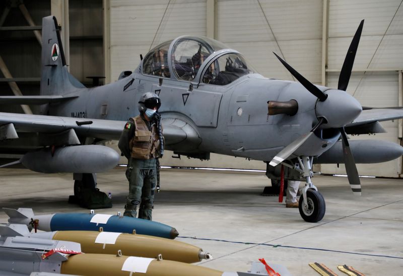 FILE PHOTO: An Afghan pilot stands next to A-29 Super Tucano plane during a handover ceremony of A-29 Super Tucano planes from U.S. to the Afghan forces, in Kabul, Afghanistan September 17, 2020. REUTERS/Omar Sobhani