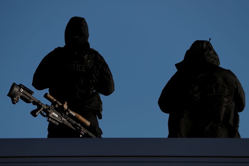 FILE PHOTO: U.S. Secret Service Counter Snipers stand guard on a neighboring rooftop during a campaign rally for President Trump in Avoca, Pennsylvania, November 2, 2020.  REUTERS/Tom Brenner