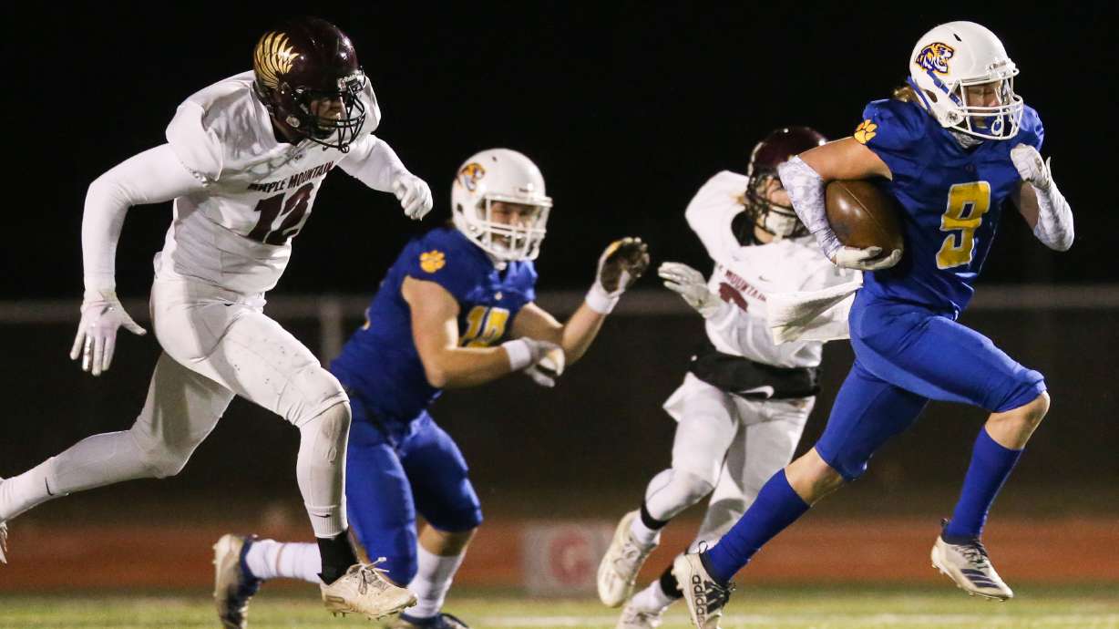 Orem's Joe Smith (9) runs the ball for a touchdown against Maple Mountain in a high school 5A state semifinal football game at Cedar Valley High School in Eagle Mountain on Friday, Nov. 13, 2020.
