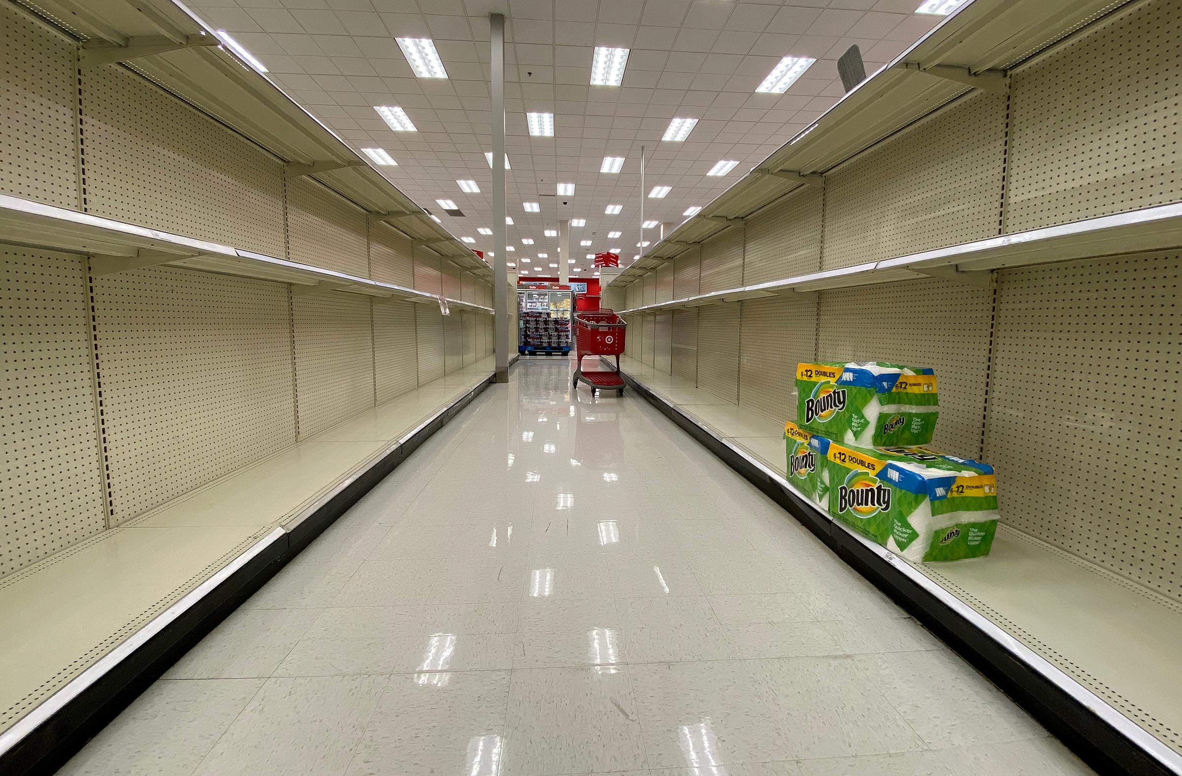 A few packages of paper towels are all that remain on shelves at a Target in Sandy on Tuesday April 14, 2020. Grocery and warehouse stores are hoping to avoid the hoarding of certain household items that took place last spring.