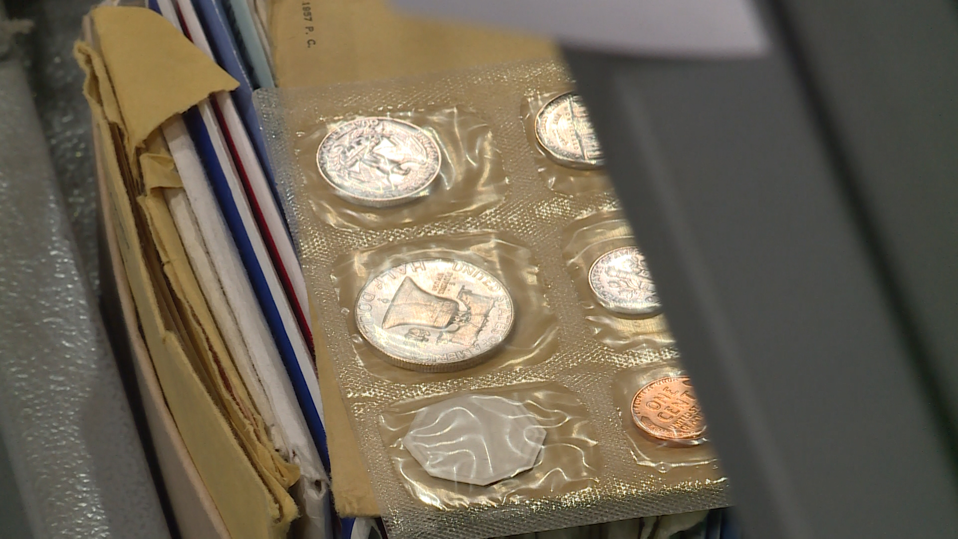 Coins are prepared for auction by Erkelens & Olson Auctioneers in Salt Lake City on Saturday, Nov. 14, 2020. The coins, from the Rust Rare Coin company, are being sold to help pay back victims of a Ponzi scheme that federal prosecutors say was being run by the family that owned Rust Rare Coin.