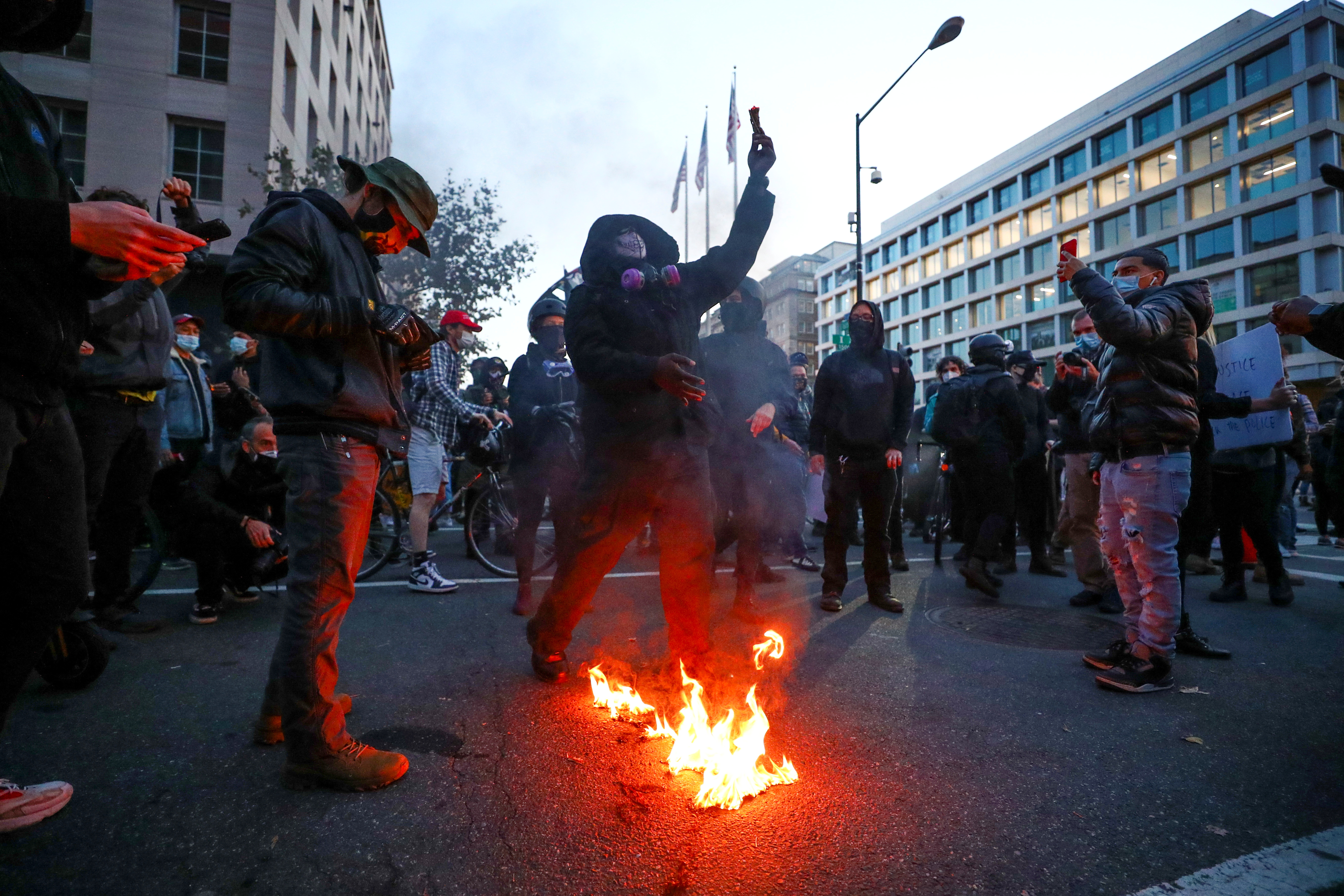 Demonstrators burn a flag during a "Stop the Steal" protest after the 2020 U.S. presidential election was called for Democratic candidate Joe Biden, in Washington, U.S. November 14, 2020.