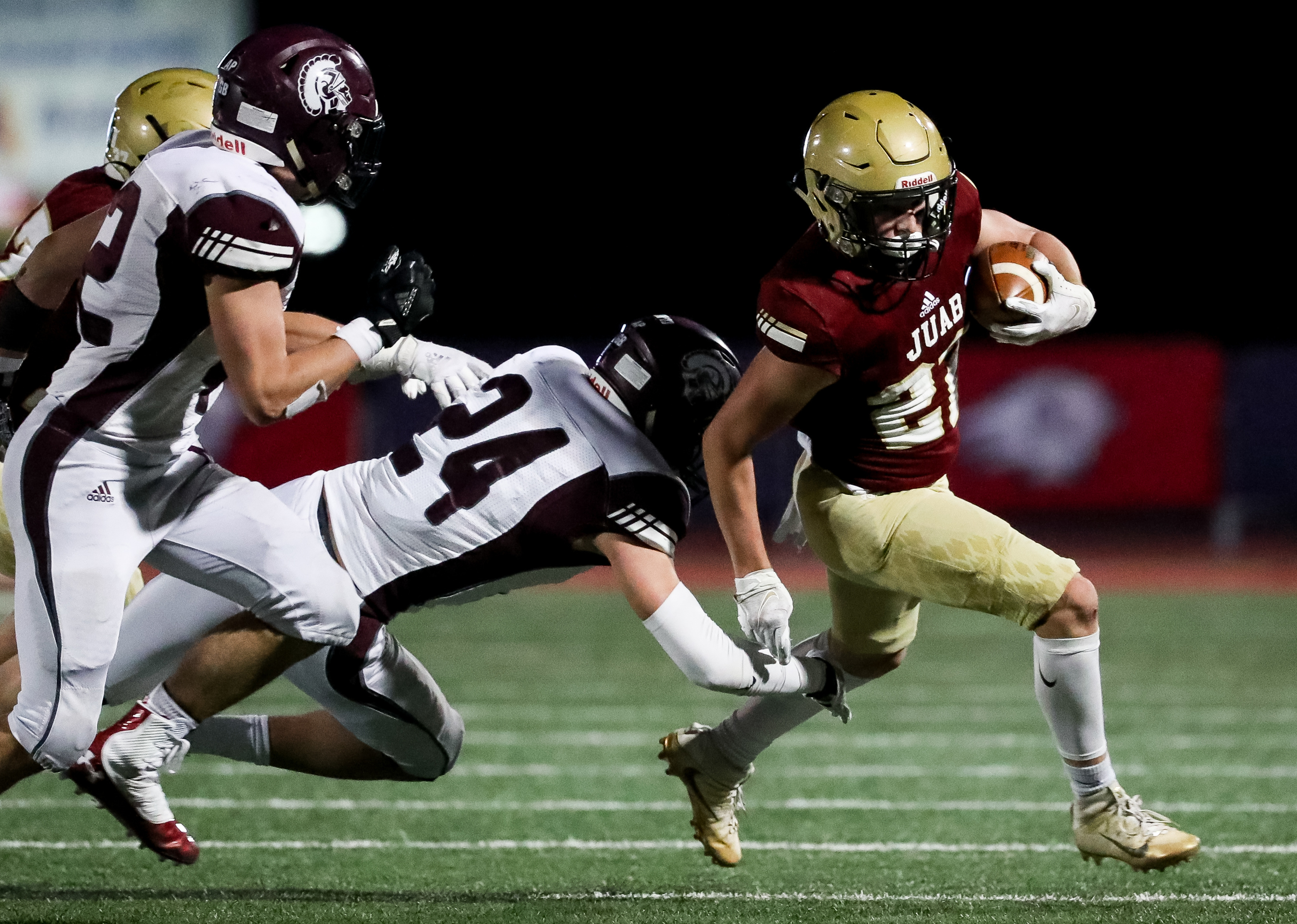 Juab's Dawson Olsen avoids the tackle from Morgan's Isaac Rees in the 3A football championship game at Dixie State University in St. George on Saturday, Nov. 14, 2020.