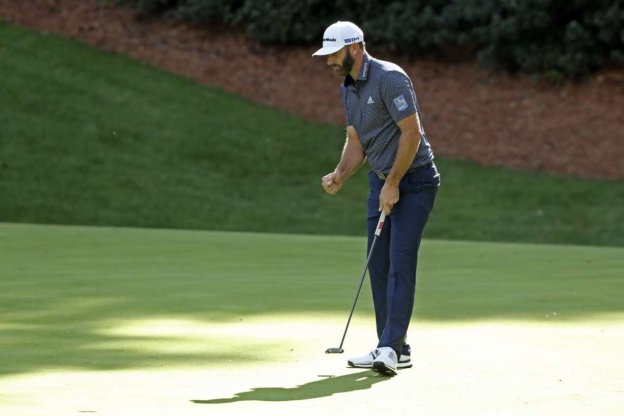 Dustin Johnson reacts after a birdie on the 13th hole during the final round of the Masters golf tournament Sunday, Nov. 15, 2020, in Augusta, Ga.