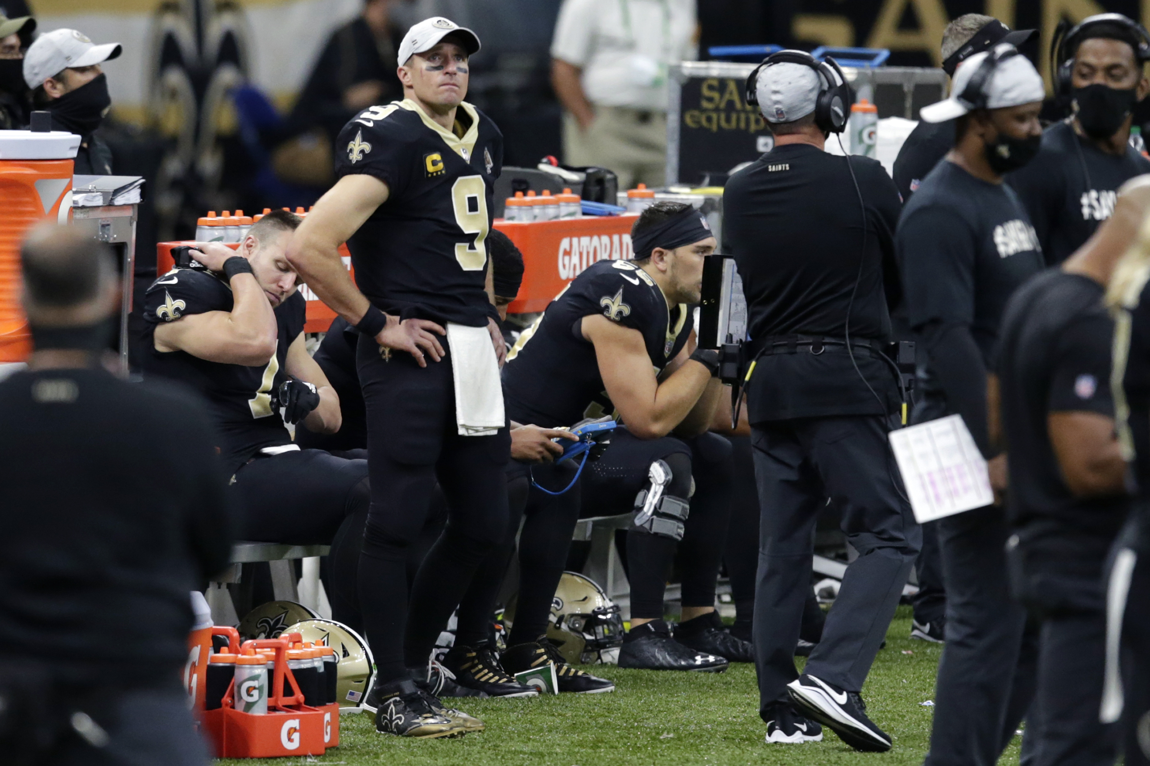 New Orleans Saints quarterback Drew Brees (9) watches from the sideline in the second half of an NFL football game against the San Francisco 49ers in New Orleans, Sunday, Nov. 15, 2020.