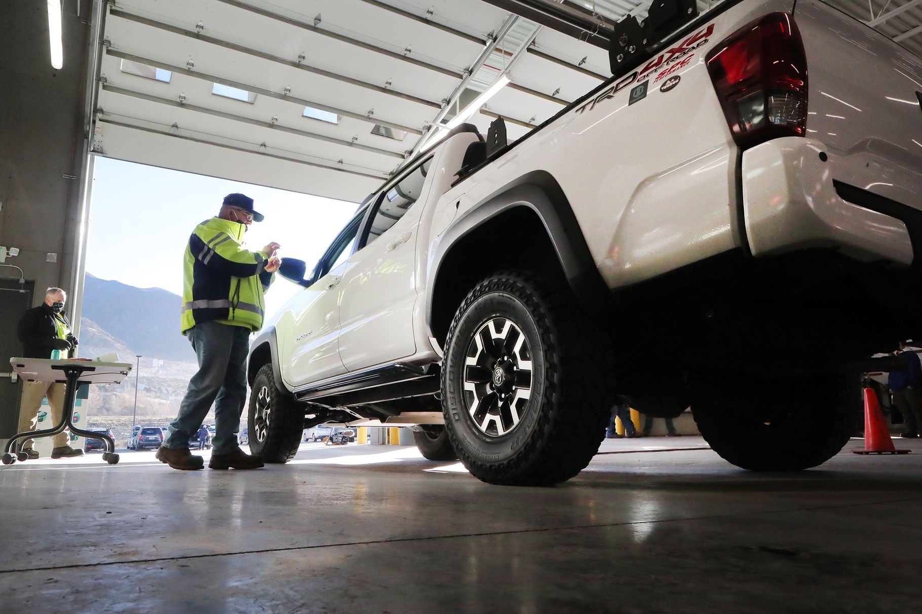The Utah Department of Transportation and the Unified Police Department relaunch the Cottonwood canyons sticker program at the UDOT maintenance shed in Cottonwood Heights on Monday, Nov. 16, 2020. For the first time, the general public will now have access to the stickers indicating their vehicle is properly equipped for winter weather. The stickers have proven to decrease vehicle inspection times at the mouth of the canyons by allowing prescreened vehicles through inspection points.