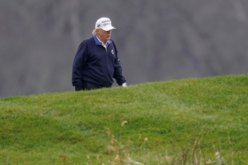 FILE PHOTO: U.S. President Donald Trump plays golf at the Trump National Golf Club in Sterling, Virginia, U.S., Nov. 15, 2020.      REUTERS/Joshua Roberts