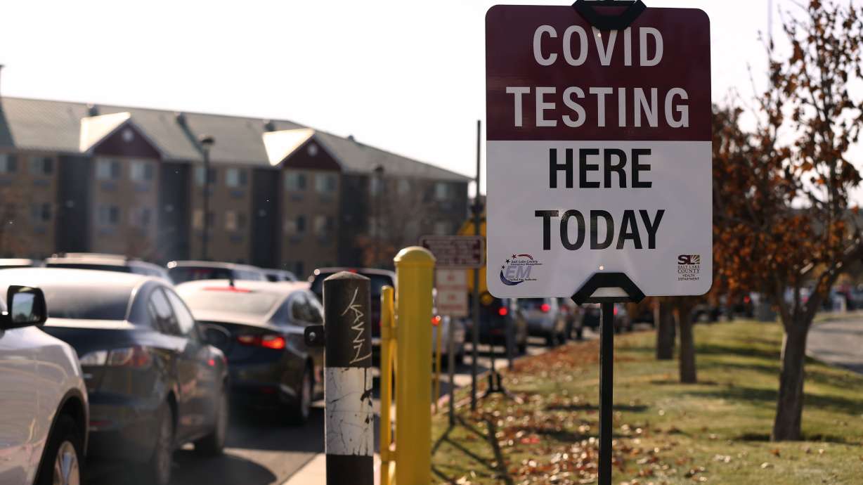 People wait in their cars to be tested for COVID-19 at a drive-thru test site at the Maverik Center parking lot in West Valley City on Thursday, Nov. 5, 2020.