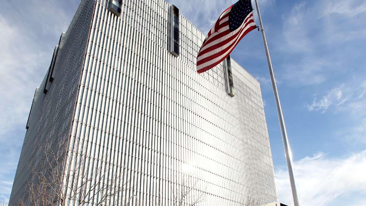 A flag flies in front of the federal courthouse in Salt Lake City on Tuesday, Feb. 18, 2020.