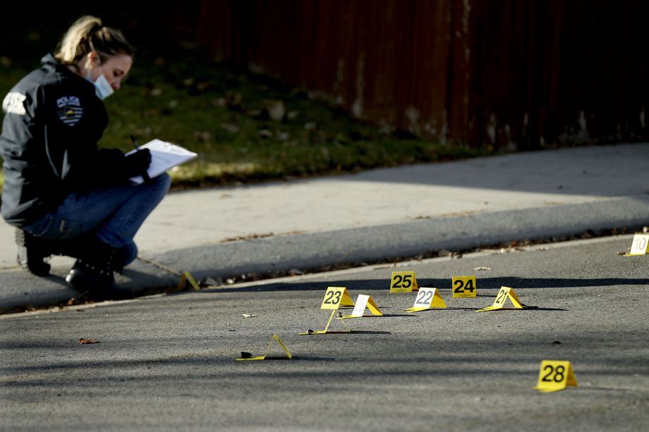 A West Jordan police officer investigates the scene of a shooting that left one man dead in West Jordan on Thursday, Nov. 19, 2020. Officers responded to the area of 7000 South and 5200 West about 2:30 a.m. and found a man deceased in the street.