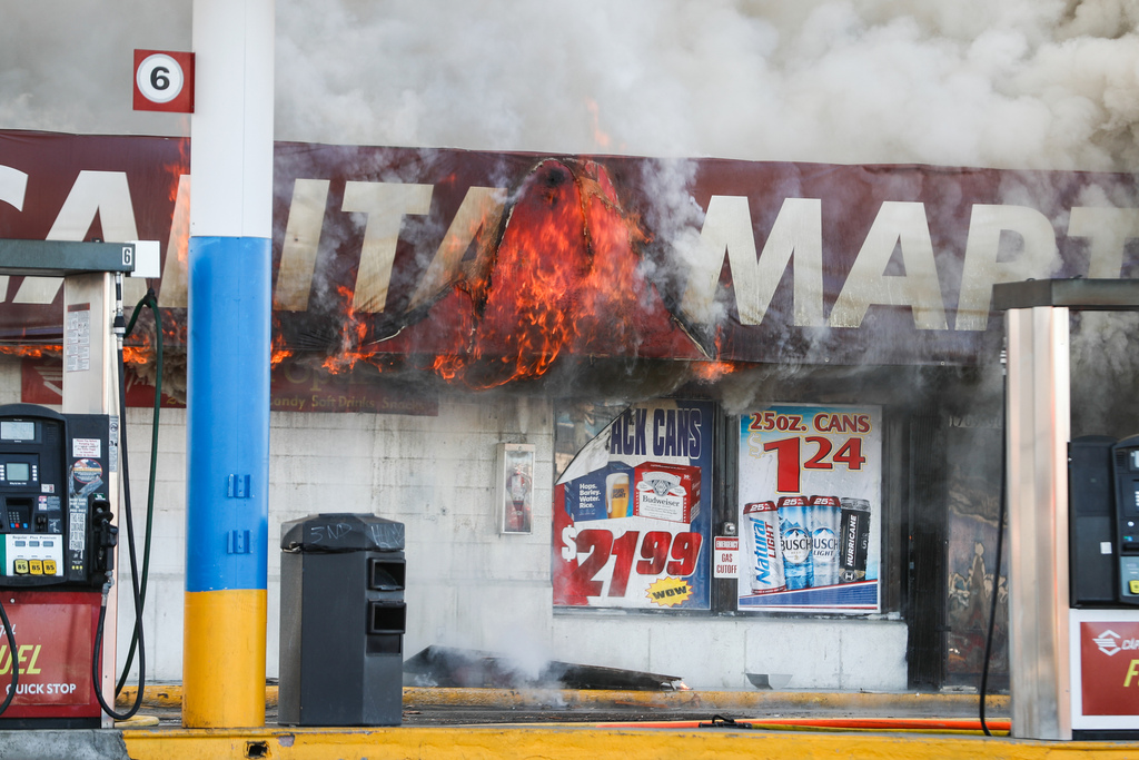 Flames burn a gas station at 1700 South and 900 West in Salt Lake City on Friday, Nov. 20, 2020.