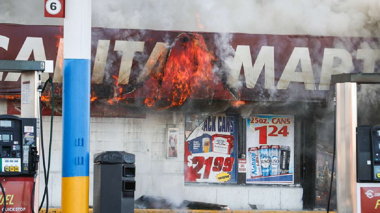 Flames burn a gas station at 1700 South and 900 West in Salt Lake City on Friday, Nov. 20, 2020.