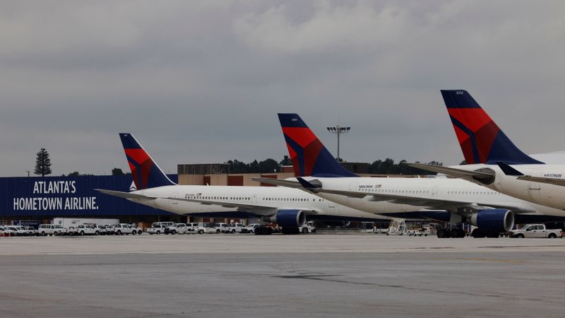 FILE PHOTO: Delta Air Lines planes are parked at their gates at Hartsfield Jackson International Airport in Atlanta, Georgia, U.S., October 27, 2020.   REUTERS/Brian Snyder