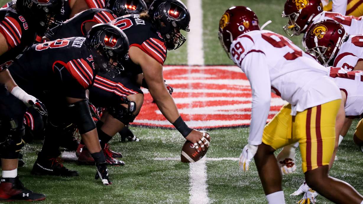 The Utah Utes offensive line and the USC Trojans defensive line square up at Rice-Eccles Stadium in Salt Lake City on Saturday, Nov. 21, 2020.