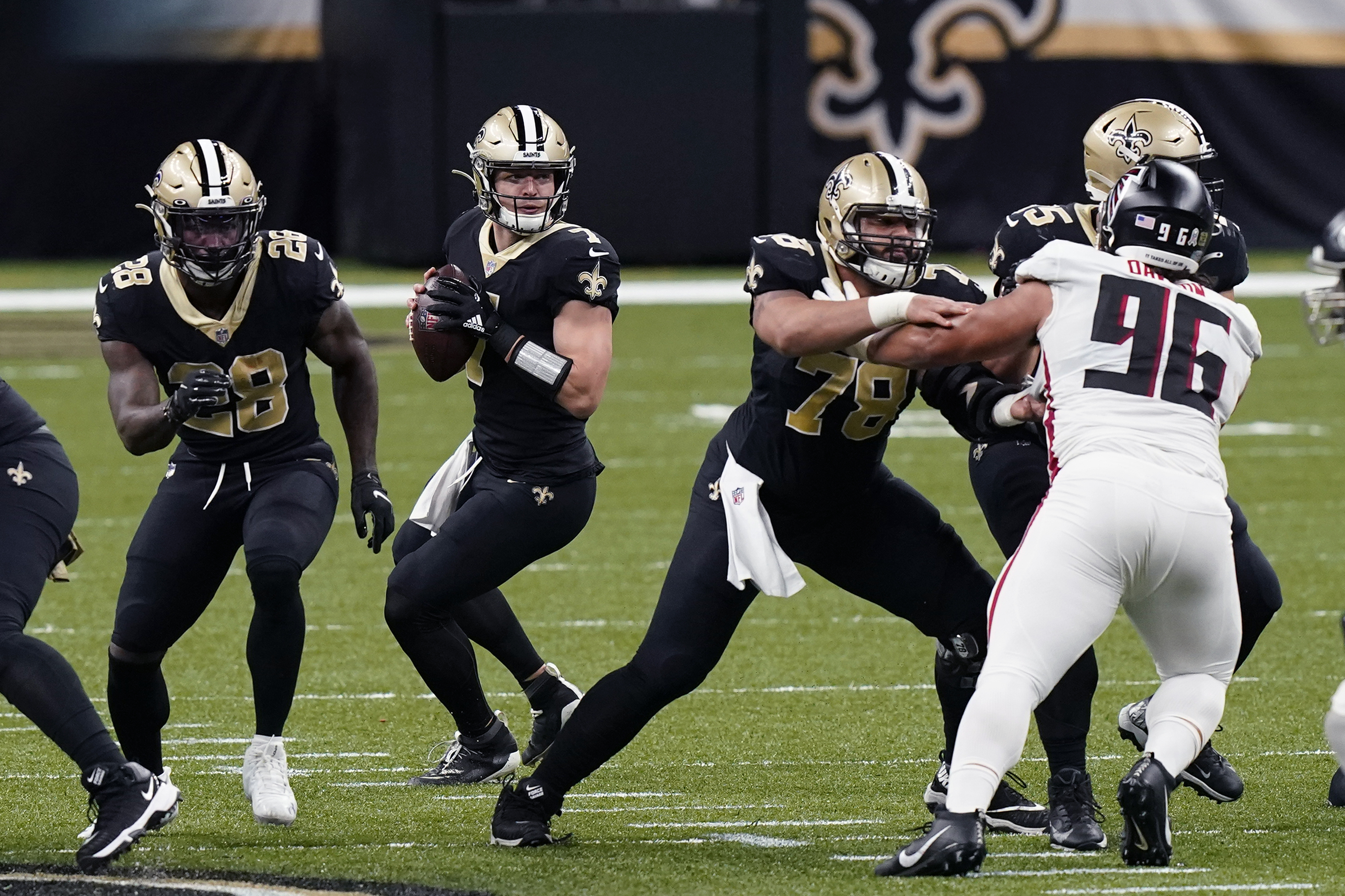 New Orleans Saints quarterback Taysom Hill (7) drops back to pass in the first half of an NFL football game against the Atlanta Falcons in New Orleans, Sunday, Nov. 22, 2020.