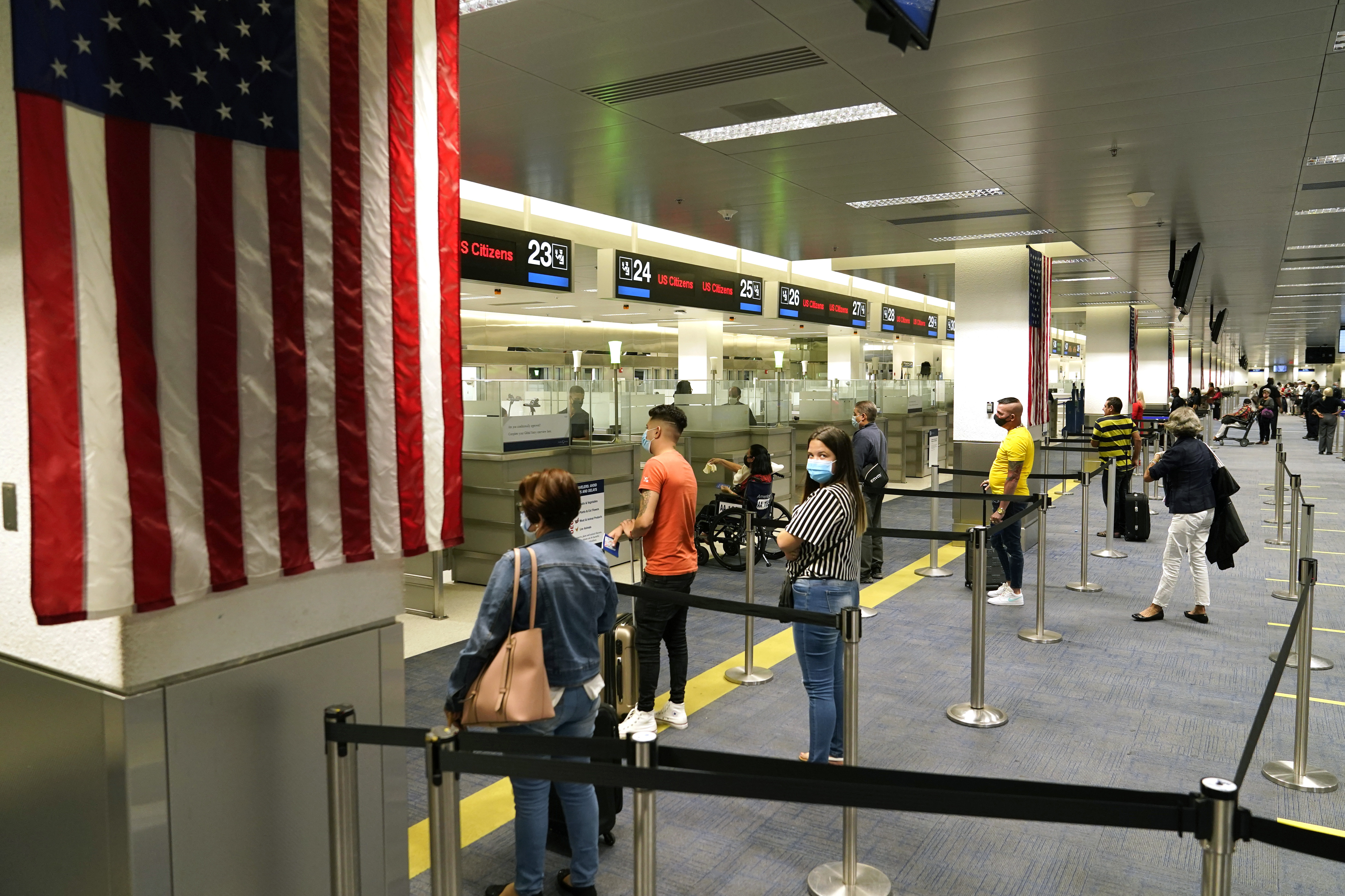 International passengers arrive at Miami international Airport where they are screened by U.S. Customs and Border Protection (CBP) using facial biometrics to automate manual document checks required for admission into the U.S. Friday, Nov. 20, 2020, in Miami. Miami International Airport is the latest airport to provide Simplified Arrival airport-wide.