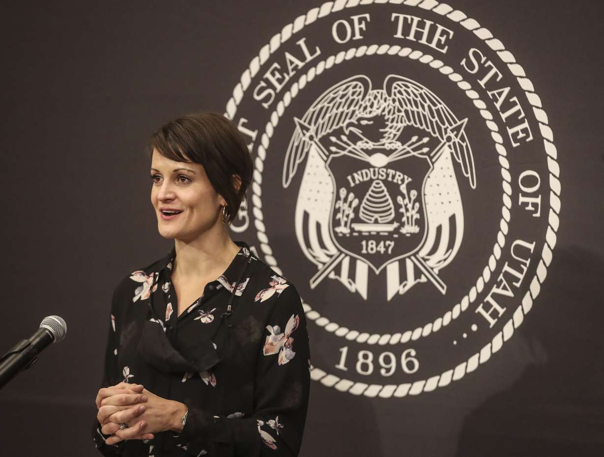 Dr. Angela Dunn, Utah's state epidemiologist, smiles as she explains that this year, because of the pandemic, she is ordering her Thanksgiving dinner from a restaurant and will celebrate with her husband and two children at their home during a COVID-19 briefing at the Capitol in Salt Lake City on Monday, Nov. 23, 2020.