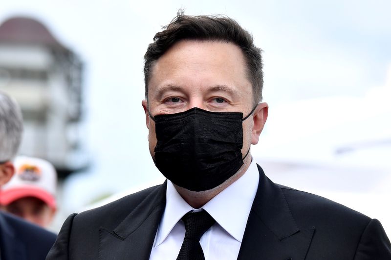 FILE PHOTO: Elon Musk wears a protective mask as he arrives to attend a meeting with the leadership of the conservative CDU/CSU parliamentary group, in Berlin, Germany September 2, 2020. Tobias Schwarz/Pool via REUTERS