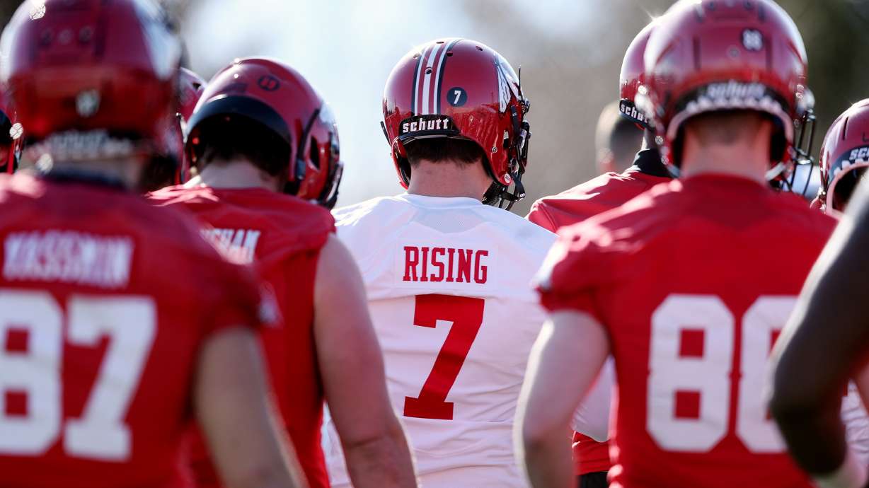 Quarterback Cameron Rising and other players circle up as head coach Kyle Whittingham calls the team together as the University of Utah football team opens spring camp at the Eccles Football Facility practice fields in Salt Lake City on Monday, March 2, 2020.