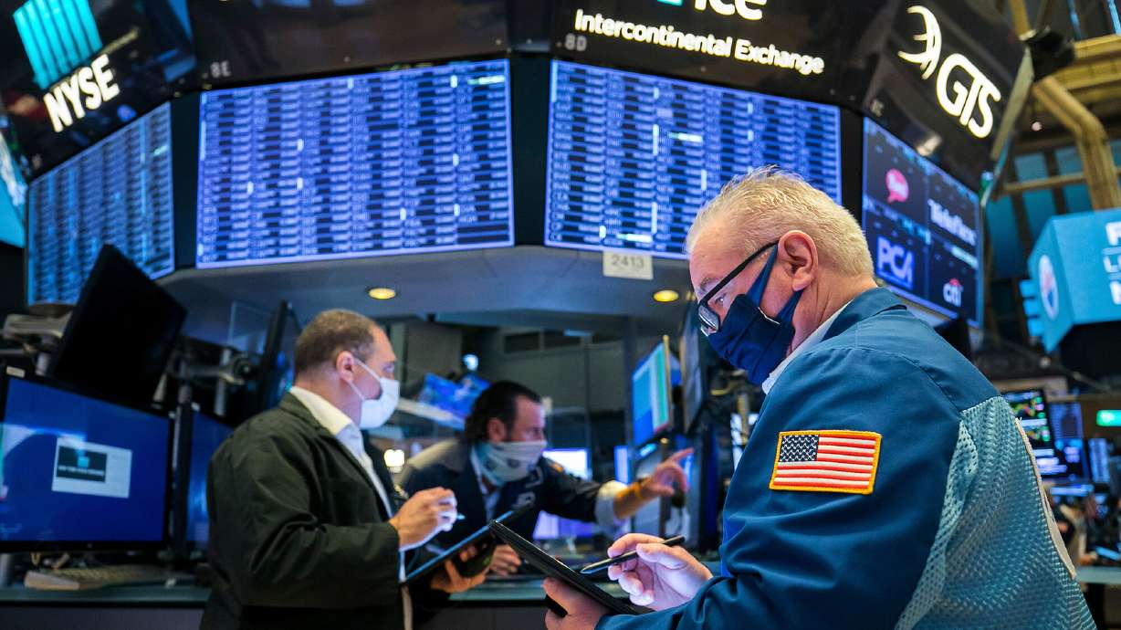 Dow crests 30,000 points on vaccine hopes, Biden transition