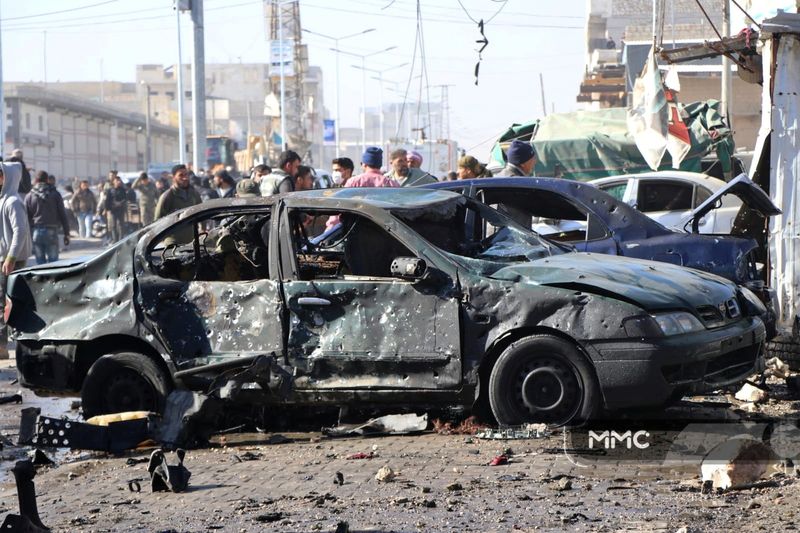 Damaged cars are pictured after an explosion in al-Bab, Syria November 24, 2020 in this picture obtained from social media. MMC/SHARIF AL HALABI/via REUTERS