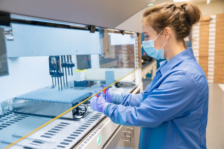 ARUP lab workers, preparing specimens.
