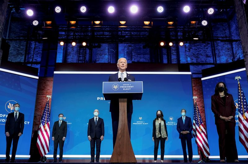 FILE PHOTO: President-elect Joe Biden stands with his nominees for his national security team at his transition headquarters in the Queen Theater in Wilmington, Delaware, U.S., November 24, 2020. (L-R), are: Antony Blinken to be secretary of state; Jake Sullivan to be U.S. national security adviser; Alejandro Mayorkas to be secretary of Homeland Security; Avril Haines to be director of national intelligence; John Kerry to be a special envoy for climate change; and Ambassador to the United Nations-nominee Linda Thomas-Greenfield, who stands behind Vice President-elect Kamala Haris.  REUTERS/Joshua Roberts