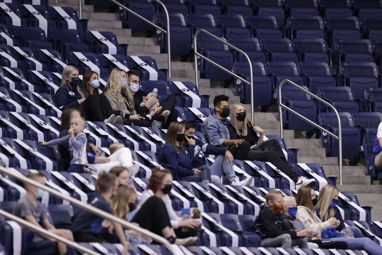 BYU fans, including recently graduated senior Yoeli Childs of the Washington Wizards, attend a college basketball game Wednesday, Nov. 26, 2020 in a college basketball season opener at the Marriott Center in Provo.