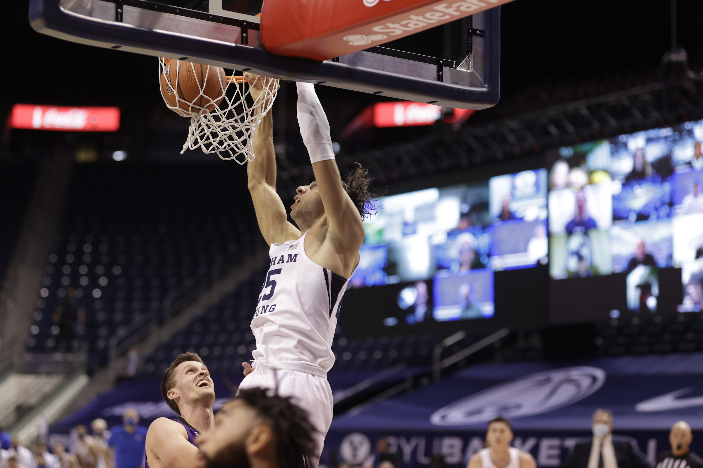 BYU forward Gavin Baxter dunks Wednesday, Nov. 26, 2020 in a college basketball season opener against Westminster at the Marriott Center in Provo.