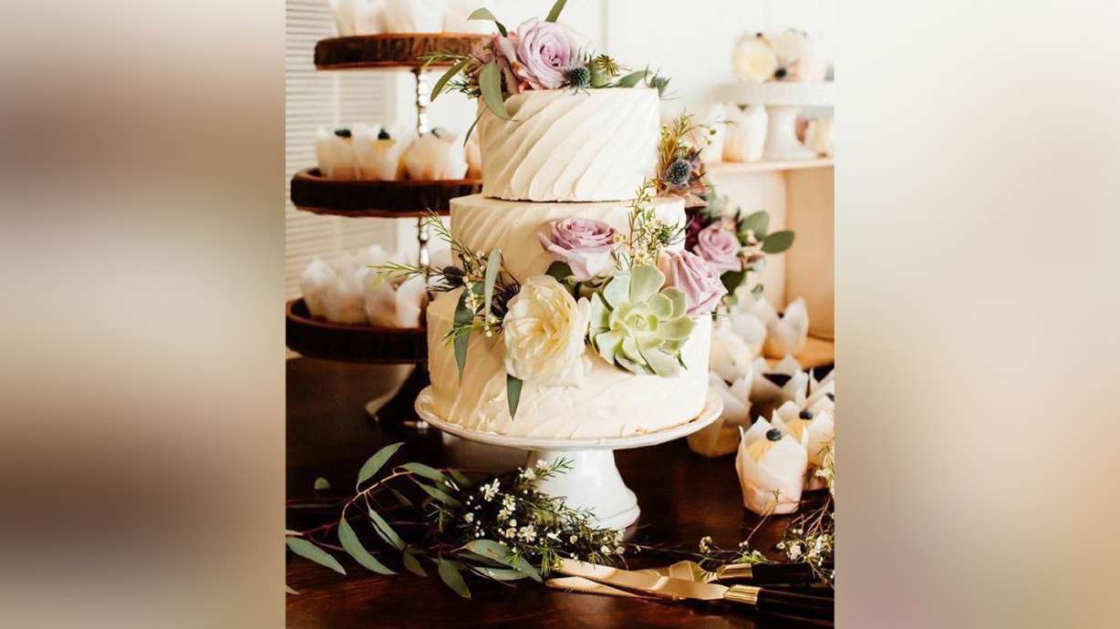 A picture of a wedding cake created by Mary Lou Timpson. The 35-year-old mother of five owns her own baking business in Colorado City, Arizona, and has made it to the quarterfinals round of "The Greatest Baker 2020" competition.