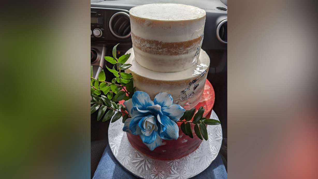 A picture of Laurell Winkler's wedding cake created by Mary Lou Timpson. The 35-year-old mother of five owns her own baking business in Colorado City, Arizona, and has made it to the quarterfinals round of "The Greatest Baker 2020" competition.
