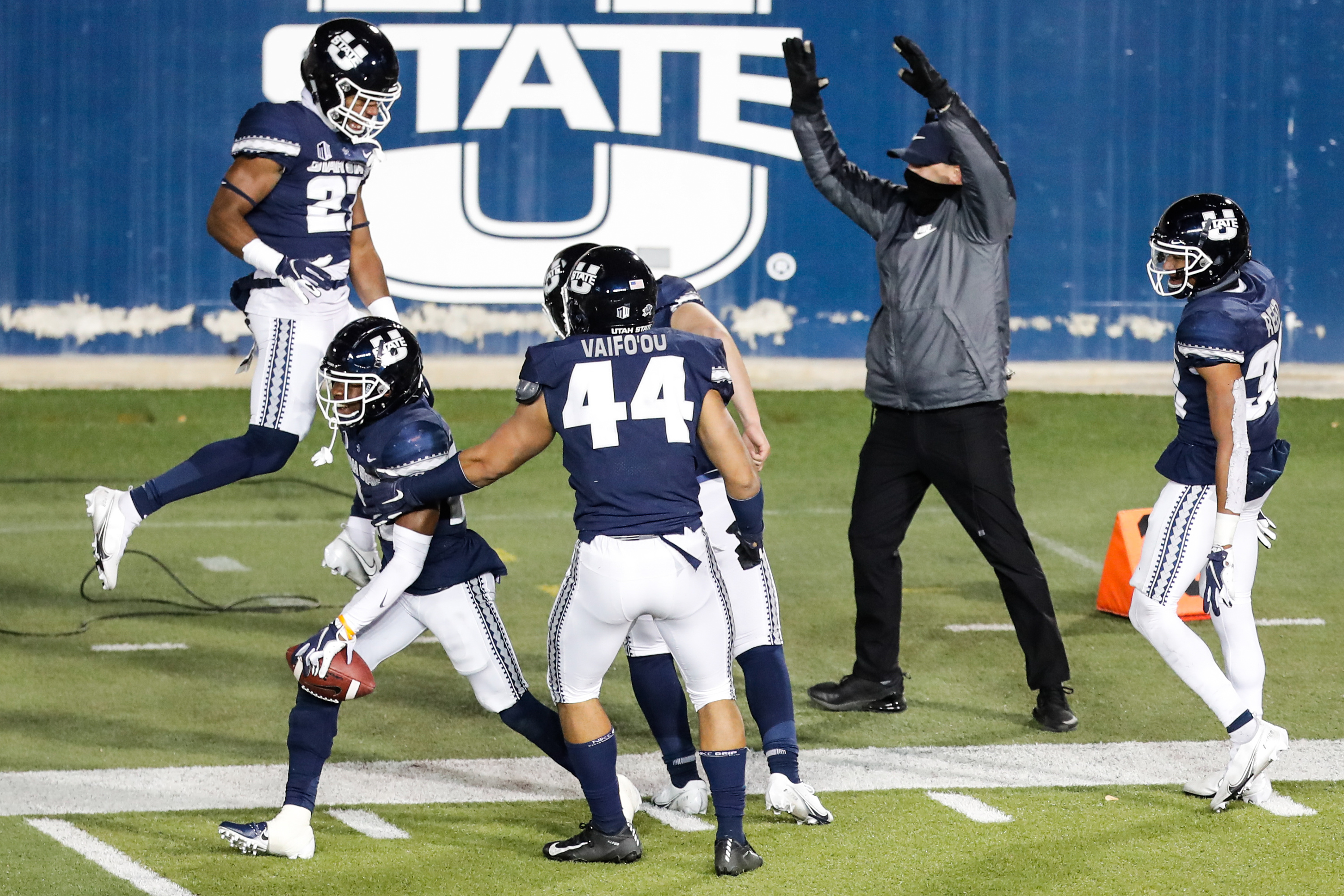 Utah State Aggies players celebrate after Utah State Aggies cornerback Michael Anyanwu (22) returns a fumble for a touchdown during an NCAA football game at Maverik Stadium in Logan on Thursday, Nov. 26, 2020. The play was then called back due to an incomplete pass.