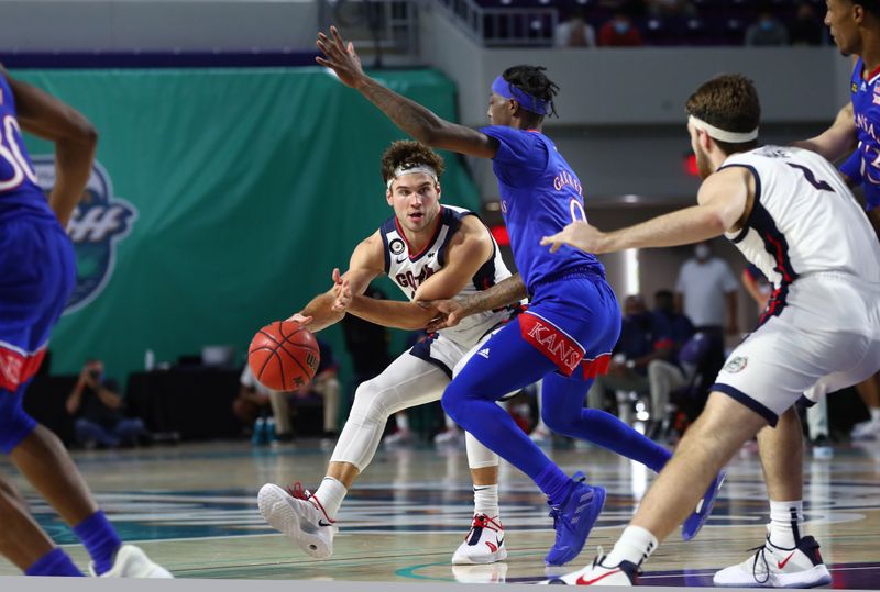 Gonzaga Bulldogs forward Corey Kispert (24) passes the ball as Kansas Jayhawks guard Marcus Garrett (0) defends during the first half of an NCAA college basketball game at Suncoast Credit Union Arena, Nov 26, 2020; Fort Myers, Florida. The Zags are ranked No. 1 in the country by the AP, No. 2 in the NCAA's NET ratings and are considered a lock to make the NCAA Tournament in March. (Photo: Kim Klemen, USA TODAY Sports via REUTERS)