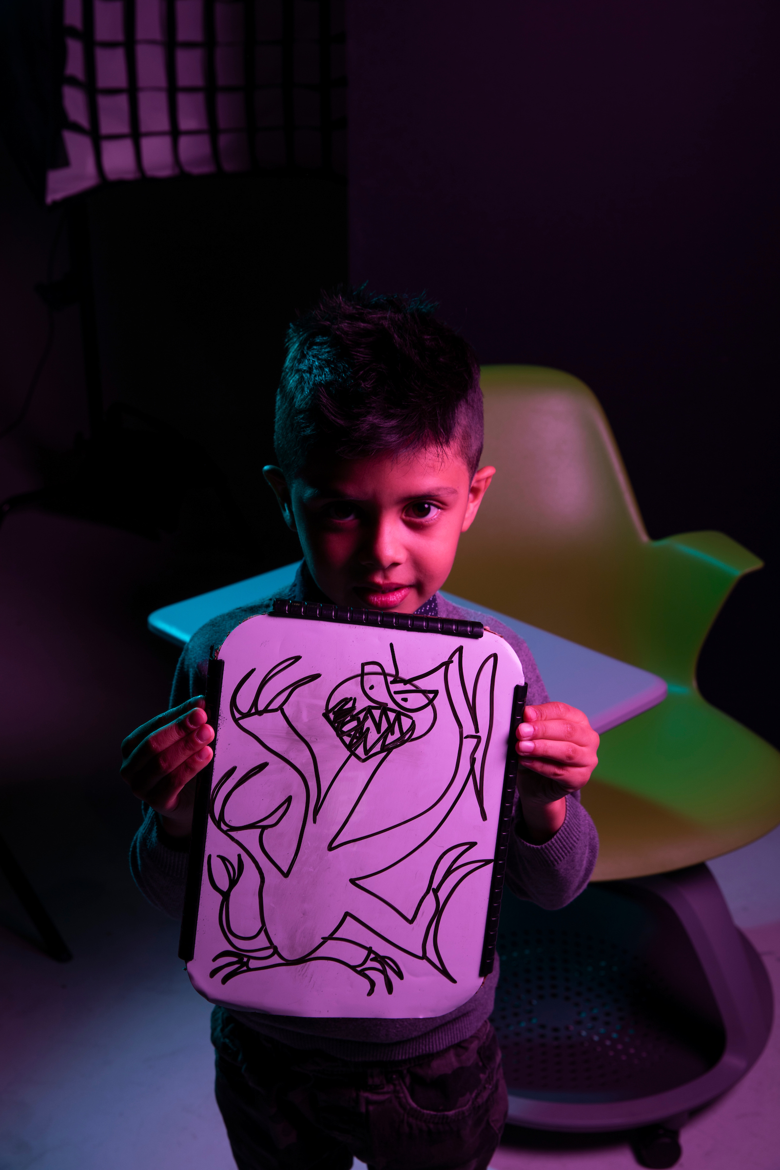 Benjamin holds a piece of his artwork at Utah Valley University in Orem on Friday, Oct. 30, 2020. Benjamin is a participant in the Super Spectrum Showcase and Soiree at the Melisa Nellesen Center for Autism at UVU.