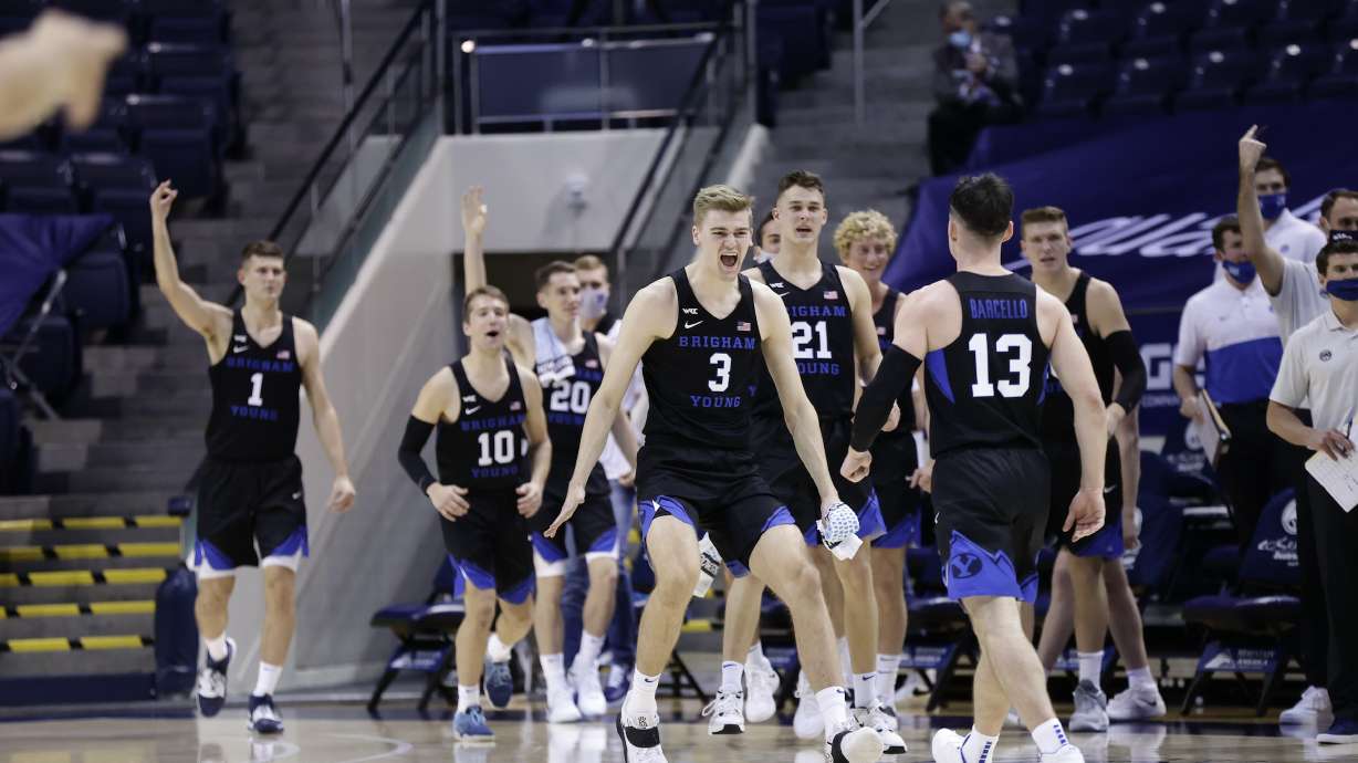 BYU center Matt Haarms (3) congratulates Alex Barcello (13) after a shot Saturday, Nov. 28, 2020 against UVU in Provo.